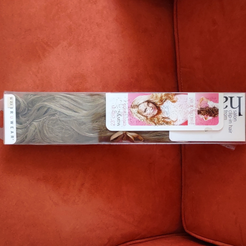 Clip in hair extensions. Color: honey ginger.
